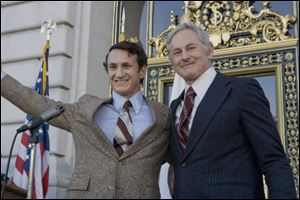 Sean Penn portrays gay rights activist Harvey Milk, left, and Victor Garber portrays San Francisco Mayor George Moscone in a scene from, 