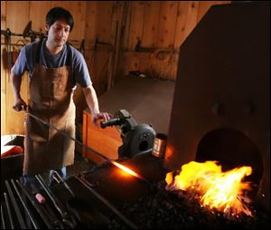 Hans Ruebel, from the Toledo Museum of Art, demonstrates blacksmithing techniques.He will be continuing his demonstrations and classes each Wednesday in February from 3 to 7 p.m at the Sylvania Historical Village, 5717 North Main St., in Sylvania. 