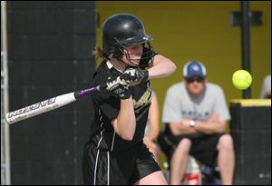 Bat poised, Perrysburg's Lindsay Rich draws a bead on the ball in a game against Springfield at the Yellow Jackets' field.