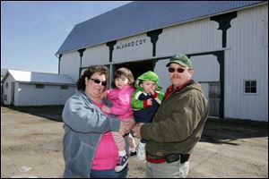 Although still living from paycheck to paycheck, Carmen and Walter Coy, with their children, have hope for spring planting.