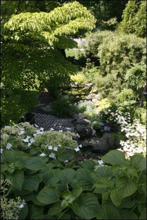 Looking down from a patio onto one of the gardens at the home of Jan and Dave Merrell.