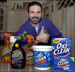 In this Dec. 6, 2002 file photo,TV pitchman Billy Mays poses with some of his cleaning products at his Palm Harbor, Fla., home. Tampa police say Mays, the television pitchman known for his boisterous hawking of products such as Orange Glo and OxiClean, has died. He was 50.