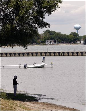 Nestor Fermin of Adrian finds a good spot to fish at Luna Pier on a near-perfect summer s day. Forecasters are calling for warmer temperatures through the weekend with a chance of rain on Saturday. 