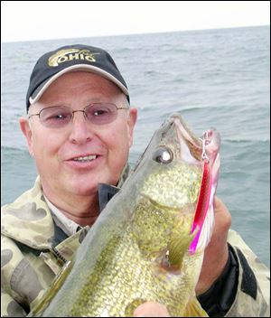 Jeff Frischkorn, below, of Mentor-on-the-Lake caught this walleye off Fairport Harbor.