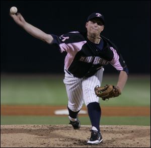 Toledo s Josh Rainwater throws a pitch in the second inning of last night s doubleheader against Scranton/Wilkes-Barre. The Yankees won the second game to split the doubleheader.