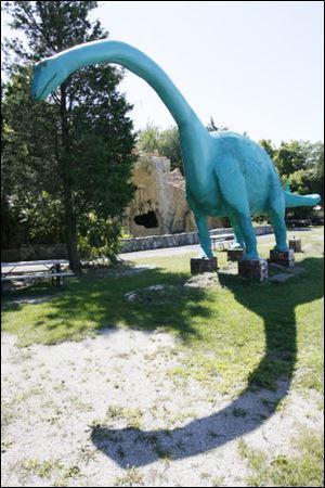 A dinosaur casts a shadow at the Prehistoric Forest
and Mystery Hill in Marblehead.