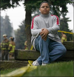 Tyler Grayson, 14, ran through the structure next door to the blaze, pounding on doors and trying to rouse residents.