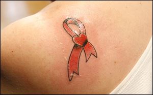 Pat Nopper's tattoo by artist Brian Finn honors her sister, who has Stage 4 breast cancer.