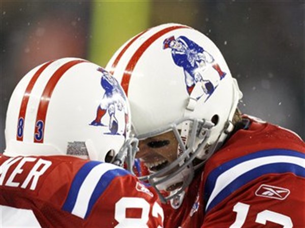 PHOTO GALLERY: Brady, Patriots romp in the snow; 59-0 win over