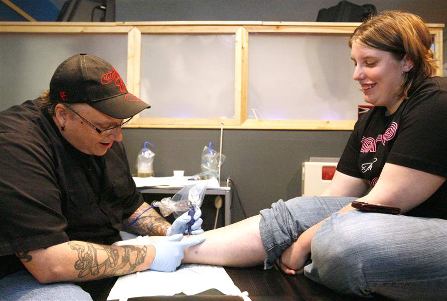 Tattoo-artists-ink-in-pink-for-cancer-research-funds