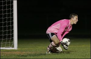 Perrysburg goalkeeper Jeremy Ashley blocks a shot. Ashley has allowed less than one goal per game. 