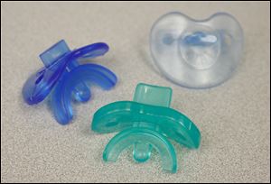 Pacifiers from Branam Oral Health Technologies will go before potential investors. Their inventor, metro Toledo dentist Dr. Stephen Branam, says traditional pacifiers can lead to bite problems.  
