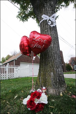 A memorial to Ysidro Mora has arisen on Eastbrook between Drummond and Kingsmoor. The memorial marks the site in West Toledo where his body was found fatally shot in a pickup. Residents in this normally tranquil neighborhood are edgy, but Toledo police say neither the victim nor the suspect had ties to the residential area. Police also say that the shooting was not a random act of violence.