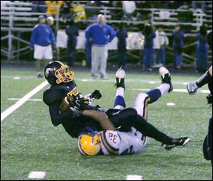 Northwood's Mike Prothero brings down Toledo Christian's David Westmeyer. Prothero leads the Rangers with 78 tackles.