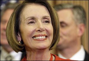 Speaker Nancy Pelosi smiles during a press conference at the U.S. Capitol, Saturday, Nov. 7, 2009 in Washington after the passage in the house of health care reform.