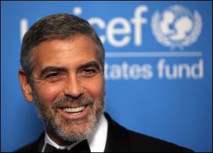 In this Dec. 10, 2009 file photo, George Clooney arrives at the UNICEF Ball honoring producer Jerry Weintraub in Beverly Hills, Calif. Clooney was nominated for a Golden Globe award for best actor in a motion picture drama for his role in the film, 