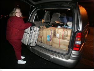 Marci Moussa, a member of Calvary United Methodist Church, is ready for the trip to New Orleans. Volunteers from Maine to California have tried to help New Orleans get back on its feet. 