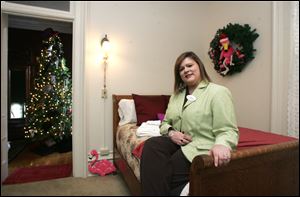 Jean Schoen, founder and executive director of Cancer Connection of Northwest Ohio, shows off the Casey-Pomeroy house.