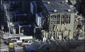 Strips of metal that once clad the plant were peeled off by the force of the explosion. The plant was being built to burn natural gas to produce electricity.