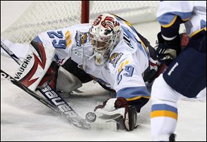 Alec Richards makes a diving save. The rookie goaltender played during his four years at Yale University.