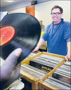 Pat O'Connor, owner of Culture Clash, sells vinyl albums at his booth at a recent record show at the Knights of Columbus Hall.