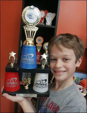 Mason with one of the many awards he's earned.