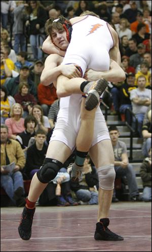 Cardinal Stritch's Kyle Gladieux takes down Edison's Dylan Howard in the 160-pound district final. Gladieux is 40-1 this season.