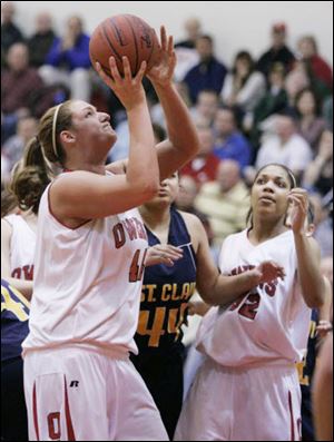 Owens' Brittany Darling sizes up a shot against St. Clair County. She led the Express with 24 points and 19 rebounds.