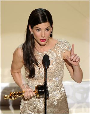 Sandra Bullock accepts the Oscar for best performance by an actress in a leading role for 'The Blind Side.' 