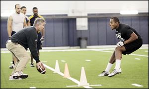 Former UT safety Barry Church, right, performs a drill under the direction of Mike Gillhammer, secondary coach for the Carolina Panthers, at Fetterman Training Center.
