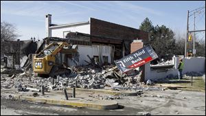 Demolition began yesterday at Fifth Third Bank's longtime branch in the Polish Village at Lagrange Street and Central Avenue. The building at 3028 Lagrange St., which originally was operated by Fifth Third's predecessor, First National Bank, will be replaced with a 4,300-square-foot office on the same site. Construction will begin in April and is expected to be completed by July 31, a Fifth Third spokesman said. Customers will be served from a modular trailer while construction is going on. 