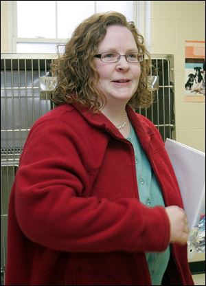 Commissioners voted to start contract talks with Julie Lyle, the finalist among 48 who sought the dog warden post.