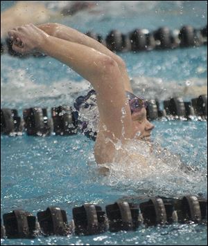 Napoleon senior Sami Zuch celebrates a state record after winning the 200-yard freestyle. She also captured the 500 freestyle crown. 