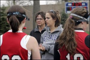 Ashley Schaar, center, coaches the Bedford girls' lacrosse team against Notre Dame Academy, where she played in high school. Her mother, Kaylene Schaar, background, is an assistant coach.