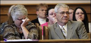 Jane and Ronald Miller, the parents of the late Ronald Miller, Jr., listen as their daughter testifies during Terri Camp Kruse's hearing. 