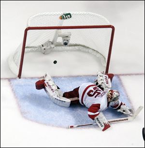 Detroit goaltender Jimmy Howard can't stop a shot by San Jose's Patrick Marleau, the game-winning goal in Saturday night's playoff game.