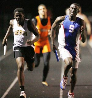 Springfield's Anthony Norwood, right, crosses the finish line in the 1600 relay. Northview edged Southview 149-139 to win the Northern Lakes League title. Springfield was third with 98 points.