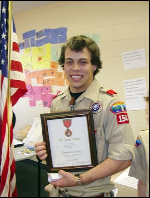 Tommy Grubs, 19, of Sylvania is credited with rescuing a woman from a crashed car that caught fire in July. He and a friend performed first aid until paramedics arrived. Scout leaders say his work showed compassion and skill and they hope it serves as an example for the community.