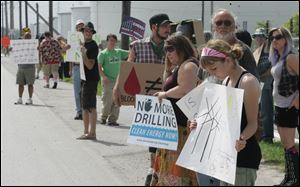 Protesters assemble along Cedar Point Road outside the BP-Husky refining operation in Oregon to add their voices to those speaking out against the disaster in the Gulf of Mexico. 