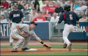 Mud Hens shortstop Will Rhymes is safe at first as Rochester first baseman Brock Peterson can't handle the throw in the fifth inning Tuesday at Fifth Third Field. 