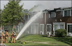 Oregon firefighters battle a fire that originated at 3123 Wick Drive in the Eastwyck apartments in Oregon on Friday.