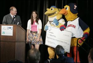 Spike and Muddy present Madison Phillips of Oregon with a ceremonial check for winning the contest to name the new cranes at the Port of Toledo.