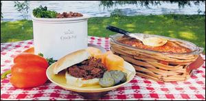 Barbecued Beef and Three-Bean Baked Beans on the picnic table.