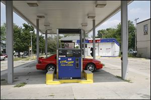 The closed gas station at 4460 Lewis Ave. was suspected of leaking fuel in 2006 and is part of a settlement involving tank leaks.