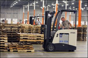 Jerry Casto of Helena, Ohio, practices his skills on the forklift.