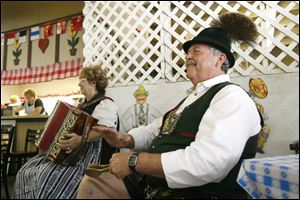 Peggy Mueller, left, and Hans Mueller, right, from Germantown, Wis., play German music in the Chalet at last year's German American Festival in Oregon.<br>
<img src=http://www.toledoblade.com/assets/jpg/TO66067417.JPG> <b><font color=red>VIEW MAP:</b></font color=red> <a href=