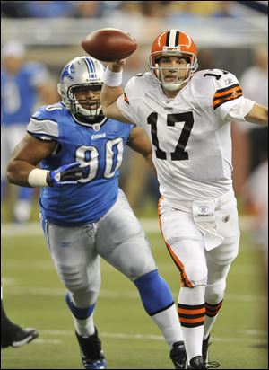 Jake Delhomme, being chased by the Lions' Ndamukong Suh, led the Browns to a 24-14 lead at halftime Saturday night in Detroit.