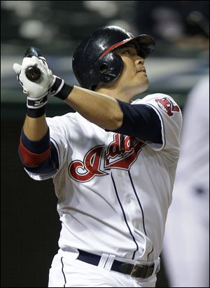 
Cleveland's Shin-Soo Choo hits a double off Los Angeles pitcher Ervin Santana. The Indians won the season series against L.A.