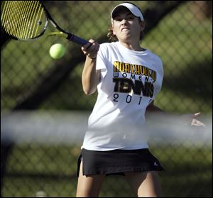 Northview freshman Megan Miller hits a shot in the Northern Lakes League tournament No. 1 singles final against Perrysburg junior April Weaver. Miller rallied to win 5-7, 6-3, 6-4. 