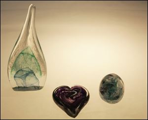 Examples of pieces that Gretchen Zientek and Richard Schroeder made, incorporating cremains